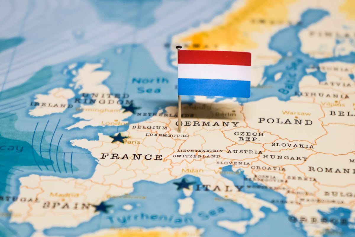 Luxembourg flag pinned on a map of Europe — your next destination in the heart of Europe